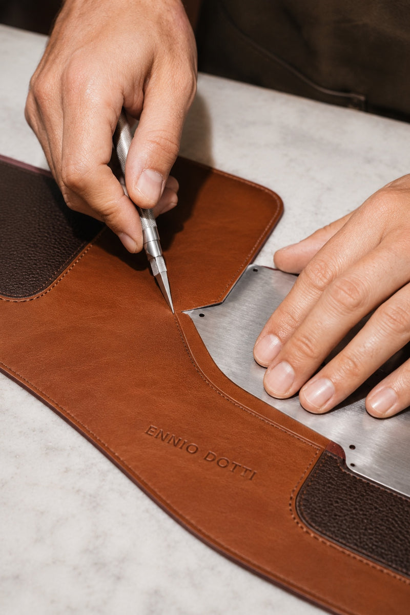 Artisan hand-cutting Dotti Leather